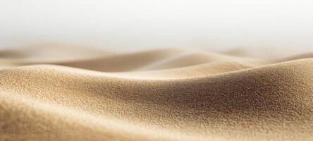 The smooth waves of golden sand creating a serene abstract landscape. photo