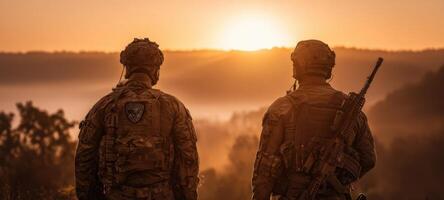 The courageous soldiers standing together against a breathtaking sunset backdrop. photo