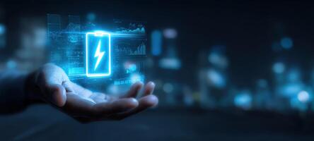 The futuristic holographic battery displayed in a human hand with energy visualization photo