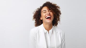 A woman laughing and smiling in a white shirt photo