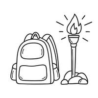 A torch resting on rock beside a backpack on the ground vector