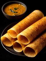 Crispy Rolled Dosa with Sambar A Close Up of South Indian Cuisine. photo