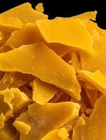 Close Up of Yellow Beeswax Pieces, Natural Texture and Color. photo
