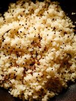 Close Up of Cooked Rice with Quinoa and Seeds. A Detailed Image of a Healthy and Nutritious Grain Dish. photo