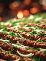 Close Up of Delicious Grilled Kofta Kebabs Garnished with Parsley and Onions. photo