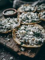 Close up of Delicious Mexican Tostadas Topped with Crumbled Cotija Cheese and Fresh Herbs. photo