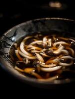 Close Up of Udon Noodles Soup with Mushrooms in a Rustic Bowl. photo