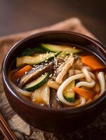 Close up of a Delicious Bowl of Udon Noodle Soup with Mushrooms and Vegetables. photo