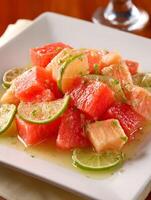 Refreshing Watermelon and Grapefruit Salad with Lime Dressing A Close Up View. photo