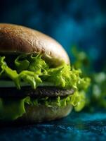 Close Up of Juicy Burger with Lettuce and Cheese on a Dark Background. photo