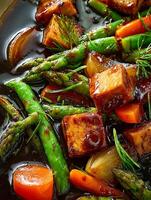 Close Up of Glazed Tofu with Asparagus and Carrots. A vibrant and appetizing image of a delicious vegetarian dish. photo