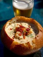 Creamy Soup in a Bread Bowl with Bacon and Beer. A delicious and comforting meal perfect for a chilly day. photo