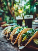 Delicious Tacos with Cilantro and Avocado Close up of Three Tacos on Wooden Board. photo