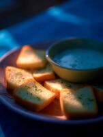 Close up of Garlic Bread with Creamy Dip on a Plate. photo
