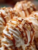 Close Up of Creamy Ice Cream with Caramel Sauce and Toasted Almonds. photo