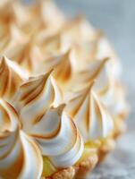 Close Up of Lemon Meringue Tart with Golden Brown Meringue Peaks. photo