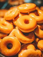 Close up of a Stack of Delicious Glazed Donuts. A tempting image perfect for food blogs, menus, or bakery websites. photo