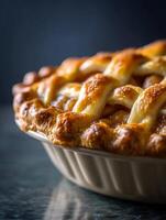Close up of a Delicious Golden Brown Apple Pie in a Ceramic Dish. photo