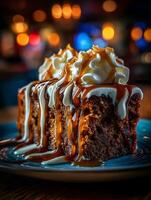 Delicious Sticky Toffee Pudding with Whipped Cream and Caramel Sauce. A close up image of a decadent dessert. photo