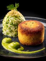 Gourmet Fried Fish Cake with Braised Cabbage and Green Sauce. photo