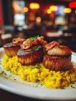 Seared Scallops with Saffron Risotto and Crispy Bacon. A gourmet seafood dish, perfect for a restaurant menu or food blog. photo