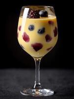 Delicious Creamy Dessert with Berries in a Wine Glass. A close up image of a sweet treat perfect for menus or food blogs. photo