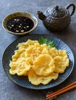 Delicious Crispy Fried Tempura on a Plate with Dipping Sauce. photo