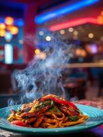 Steaming Hot Plate of Noodles and Chicken in a Vibrant Restaurant Setting. photo