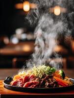 Steaming Hot Plate of Sizzling Beef and Vegetables. A close up image of a delicious and flavorful meal. photo
