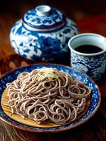 Close up of a delicious bowl of soba noodles, served on a rustic wooden table with traditional Japanese tea set. photo