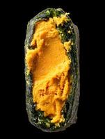 Close up of Uni Sea Urchin inside Seaweed Wrap. A delicious Japanese delicacy. photo