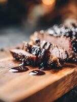 Close up of Sliced Roasted Meat with Rich Glaze on Wooden Board. photo