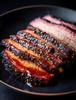 Close Up of Sliced Smoked Brisket with Barbecue Sauce. A delicious image perfect for menus, cookbooks, or food blogs. photo