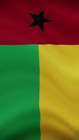 Guinea-Bissau Waving Flag in Vertical Orientation. Realistic Flag Animation. Seamless Loop Background. video