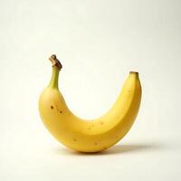 Single Yellow Banana Isolated on a Plain Background photo