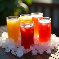 Refreshing Colorful Drinks with Ice Cubes on Wood Table photo