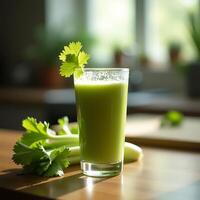 Celery Juice in Glass on Wooden Table with Fresh Celery photo