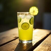 Refreshing Lemonade Drink with Lime and Ice on Wooden Table photo