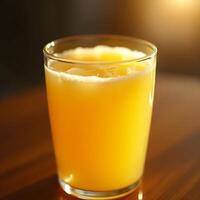 Orange Juice in Glass with Ice Cold Beverage on a Table photo