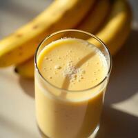 Banana Smoothie in Glass with Bananas Fresh Blended Drink photo