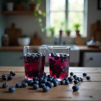 Preparing Blueberry Juice in Glasses on a Wooden Table photo