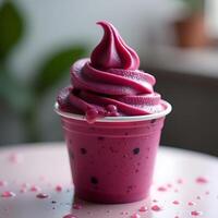 Pink Frozen Yogurt in Cup with Berries and Drips photo
