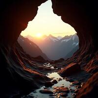 Cave View of Mountains and Sunset with Water Stream photo