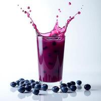 Blueberry Juice Splash in Glass with Fresh Berries photo