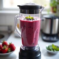 Berry Smoothie in Blender on Kitchen Counter Ready to Serve photo