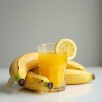 Preparing Banana Juice with Lemon in Glass photo