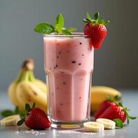 Strawberry Banana Smoothie in Glass with Fresh Fruit photo