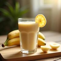Banana Smoothie in Glass with Fruit Slice on Wooden Board photo