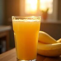 Pouring Yellow Drink with Fruit Near Sunny Window photo