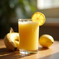 Serving of Refreshing Yellow Smoothie with Banana and Lemon photo